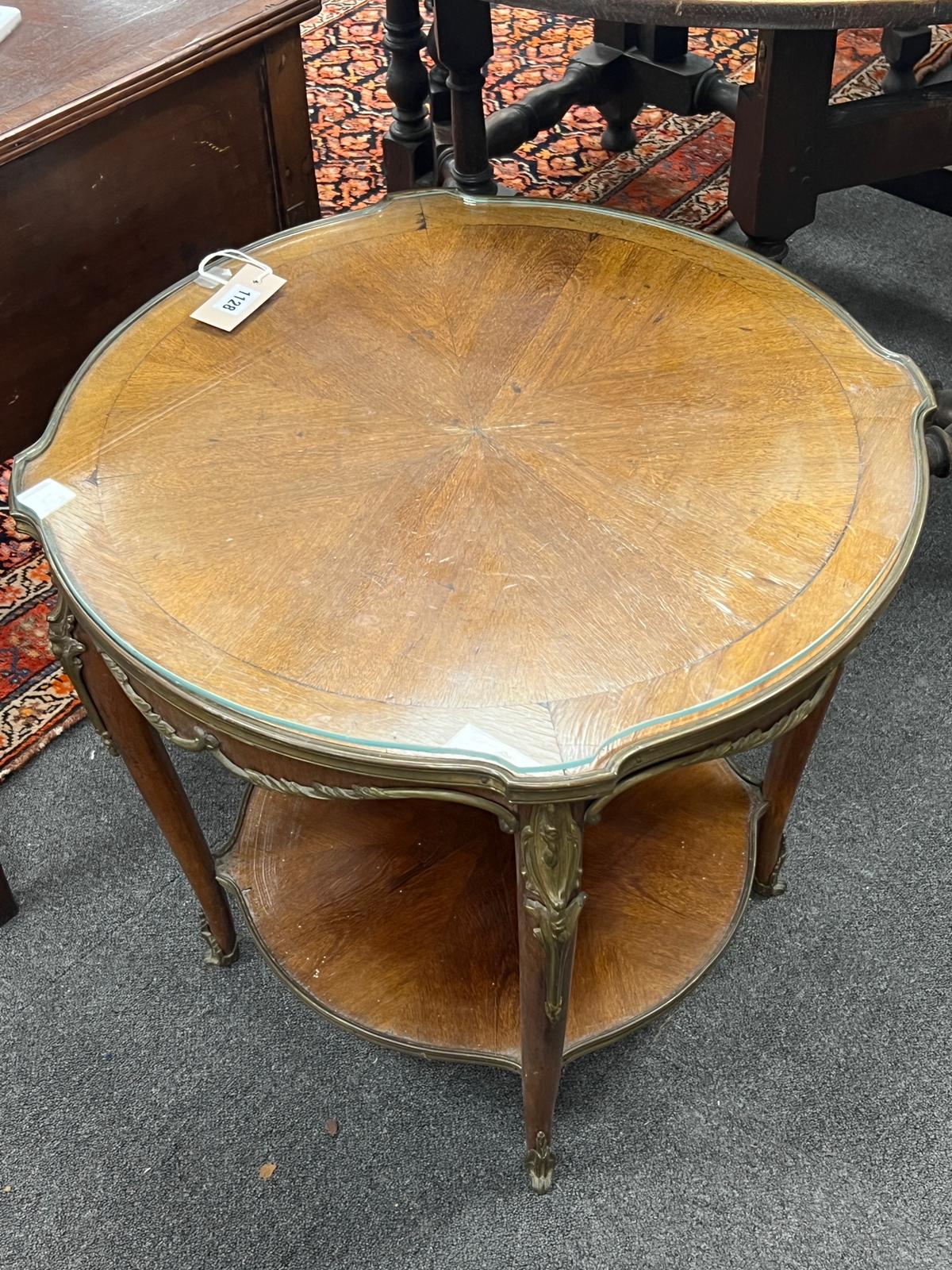 A Louis XVI style gilt metal mounted circular mahogany two tier occasional table, diameter 61cm, height 57cm